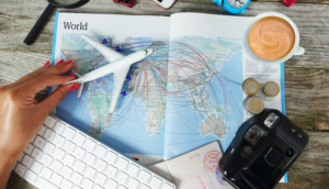 Woman with airplane toy over the world map